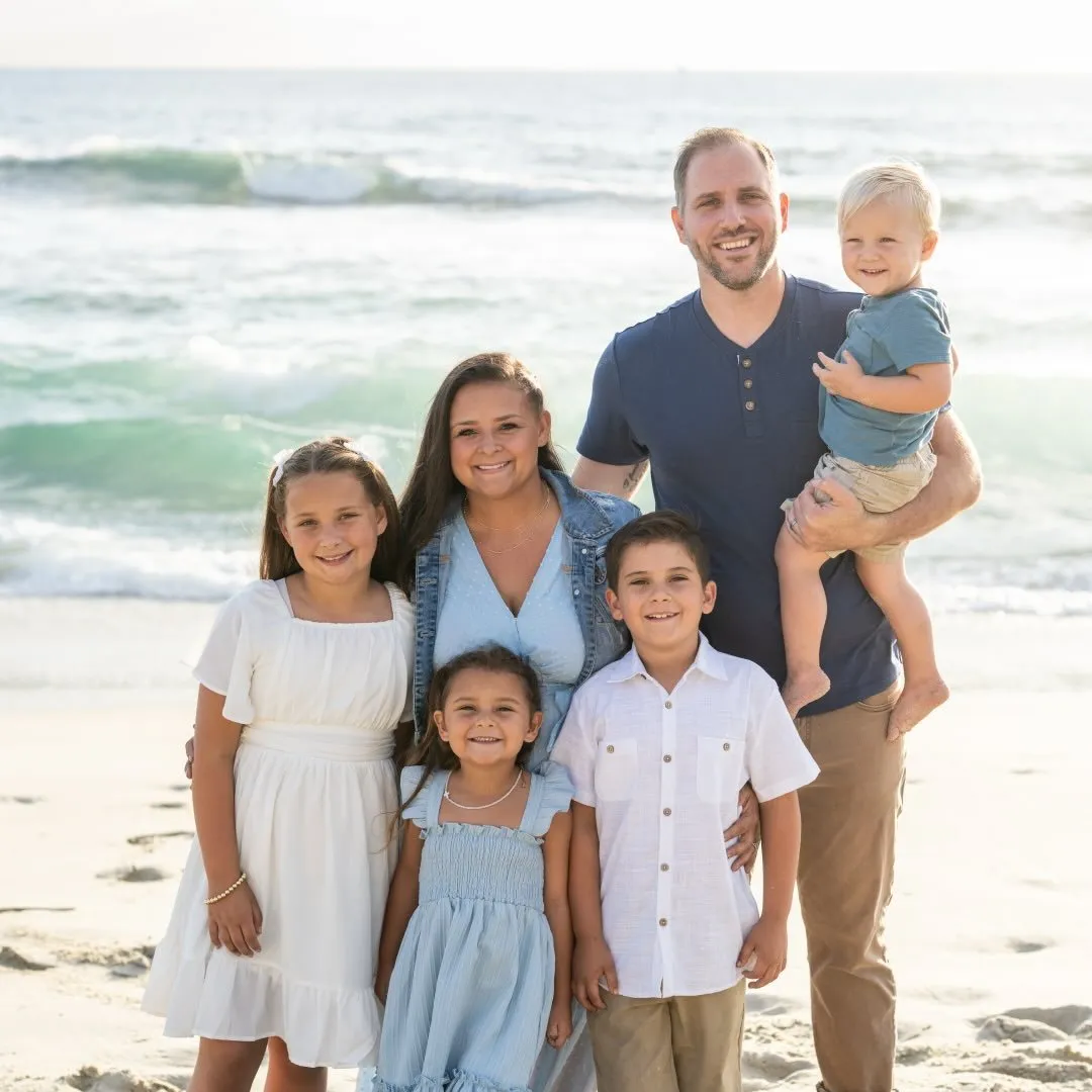 Luke Shankula with his wife and four kids at the beach in San Diego